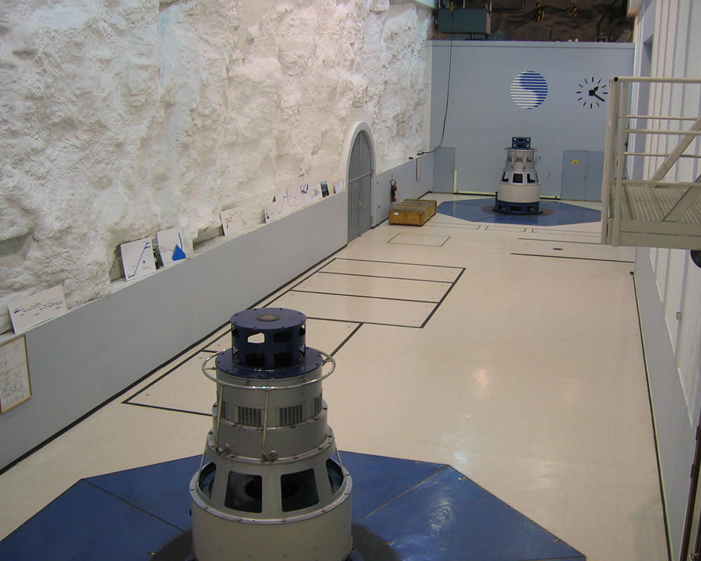 Innsett power plant reception building with turbine wheel and anniversary plaque