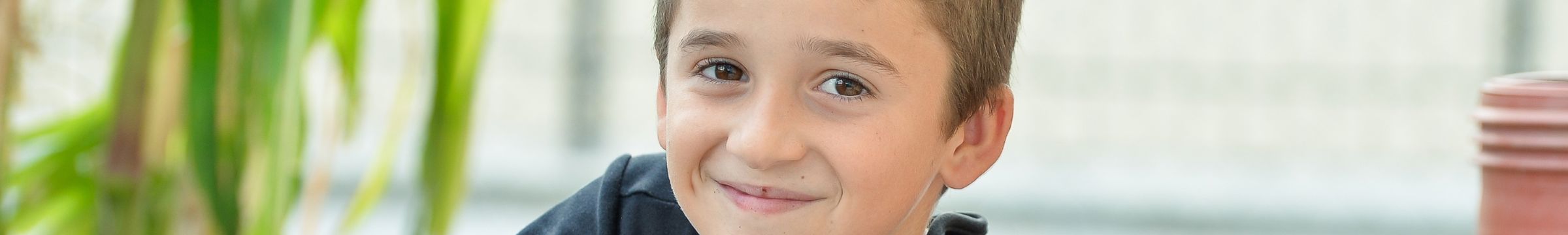 Boy sitting and smiling