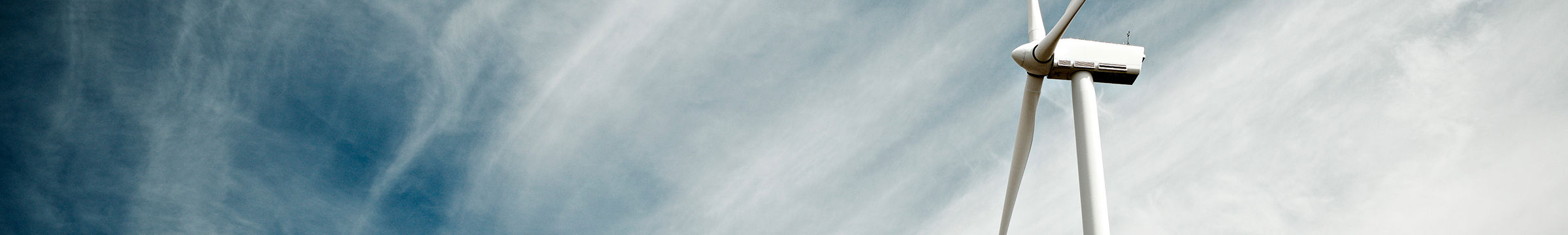 Wind mill and cloudy sky